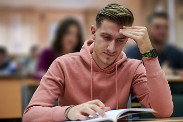 Image showing the student has a headache in class