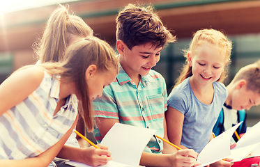 Image showing group of happy elementary school students outdoors