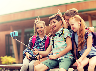 Image showing happy elementary school students taking selfie