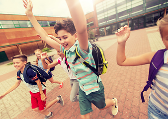 Image showing group of happy elementary school students running