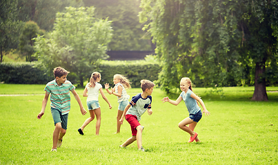 Image showing happy kids running and playing game outdoors