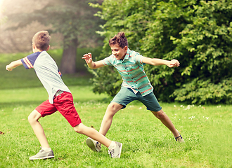 Image showing happy kids running and playing game outdoors