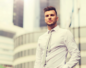 Image showing young man in shirt and tie on city street