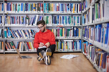 Image showing the students uses a notebook, laptop and a school library