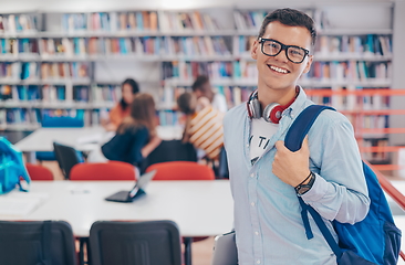 Image showing the student uses a notebook, latop and a school library