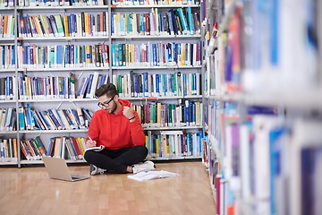 Image showing the students uses a notebook, laptop and a school library