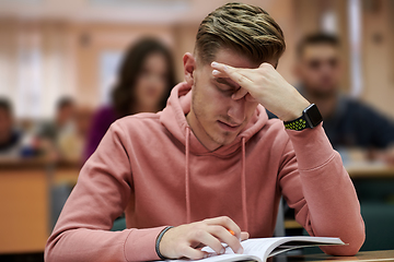 Image showing the student has a headache in class