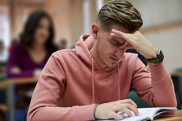 Image showing the student has a headache in class