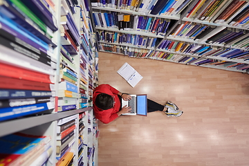 Image showing the students uses a notebook, laptop and a school library