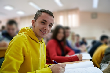 Image showing student taking notes while studying in high school