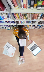 Image showing the student uses a notebook and a school library