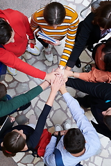 Image showing group of happy young people showing their unity.