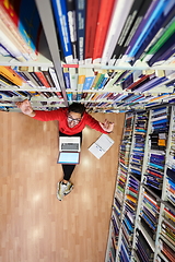 Image showing the students uses a notebook, laptop and a school library