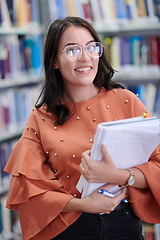 Image showing the student uses a notebook and a school library