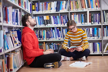 Image showing the students uses a notebook, laptop and a school library