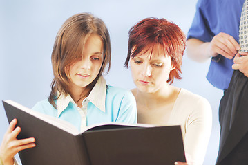 Image showing A family with a book