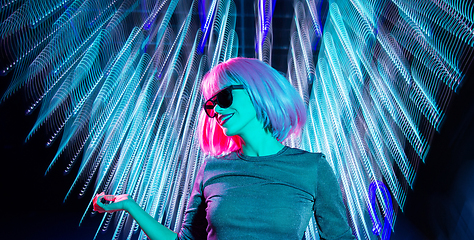 Image showing woman in wig and sunglasses dancing at nightclub