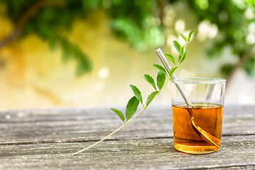 Image showing verbena tea on old wooden planks