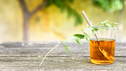 Image showing verbena tea on old wooden planks