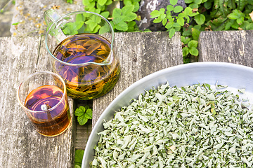 Image showing verbena tea on old wooden planks