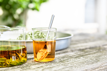 Image showing verbena tea on old wooden planks