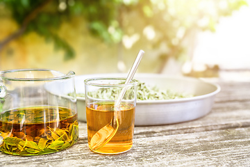 Image showing verbena tea on old wooden planks