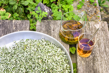 Image showing verbena tea on old wooden planks