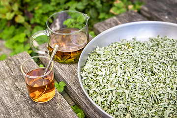 Image showing verbena tea on old wooden planks