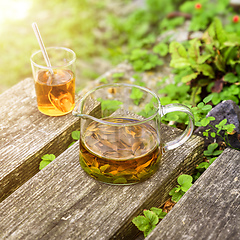 Image showing verbena tea on old wooden planks