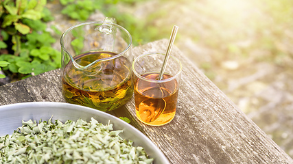 Image showing verbena tea on old wooden planks