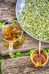 Image showing verbena tea on old wooden planks