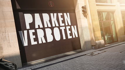 Image showing the text parking forbidden in german language on a garage door