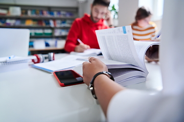 Image showing students group working on school project together on tablet computer at modern university