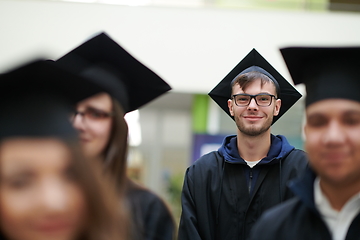 Image showing Group of diverse international graduating students celebrating