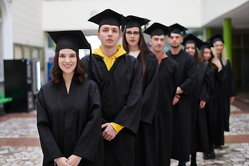 Image showing Group of diverse international graduating students celebrating