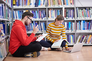 Image showing the students uses a notebook, laptop and a school library