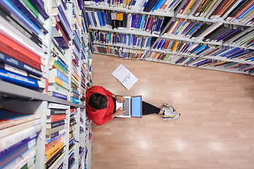 Image showing the students uses a notebook, laptop and a school library