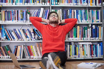 Image showing the students uses a notebook, laptop and a school library