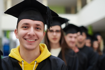 Image showing Group of diverse international graduating students celebrating