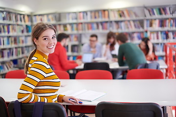 Image showing student taking notes for school class