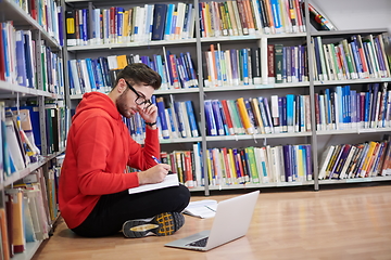 Image showing the students uses a notebook, laptop and a school library