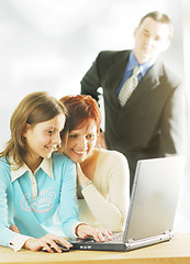 Image showing A family with a notebook