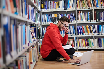 Image showing the students uses a notebook, laptop and a school library