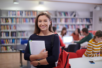 Image showing the student uses a notebook and a school library