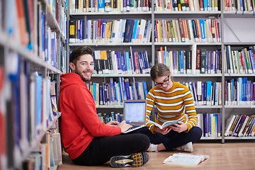 Image showing the students uses a notebook, laptop and a school library