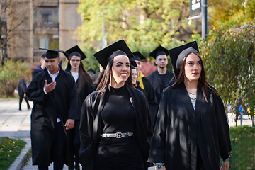 Image showing Group of diverse international graduating students celebrating