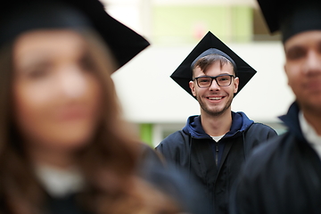 Image showing Group of diverse international graduating students celebrating