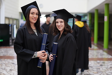 Image showing Group of diverse international graduating students celebrating