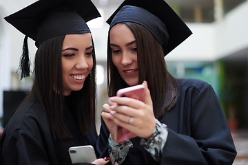 Image showing Group of diverse international graduating students celebrating