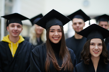 Image showing Group of diverse international graduating students celebrating